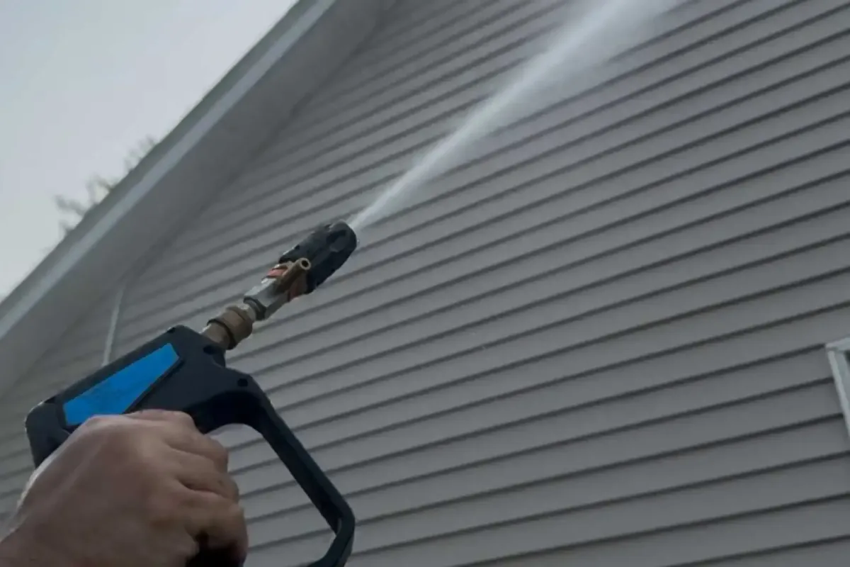 Soft washing vinyl siding on home exterior in Hudson Valley NY