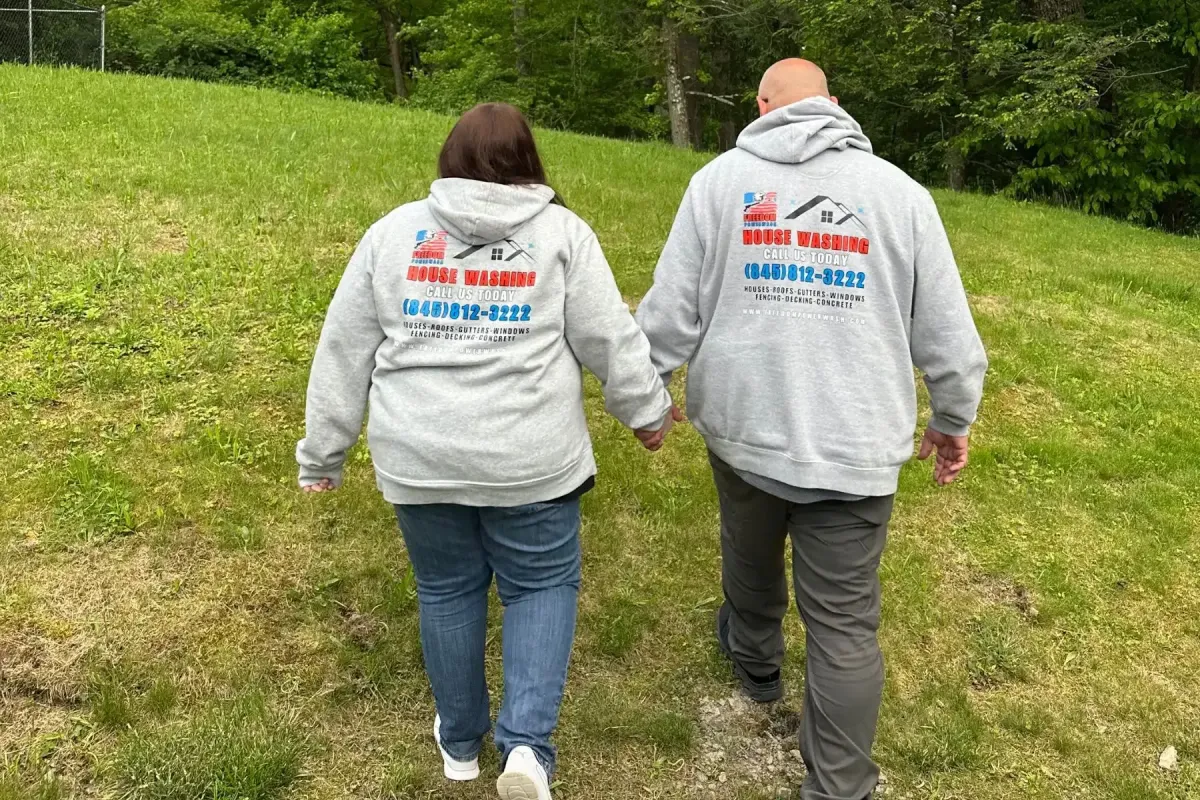 Freedom Powerwash Owners walking up a hill in Hurley, NY 