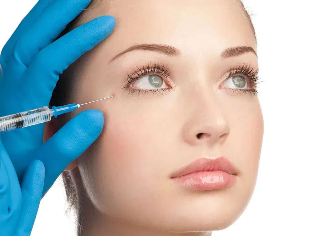 grayscale photo of a woman holding a cigarette