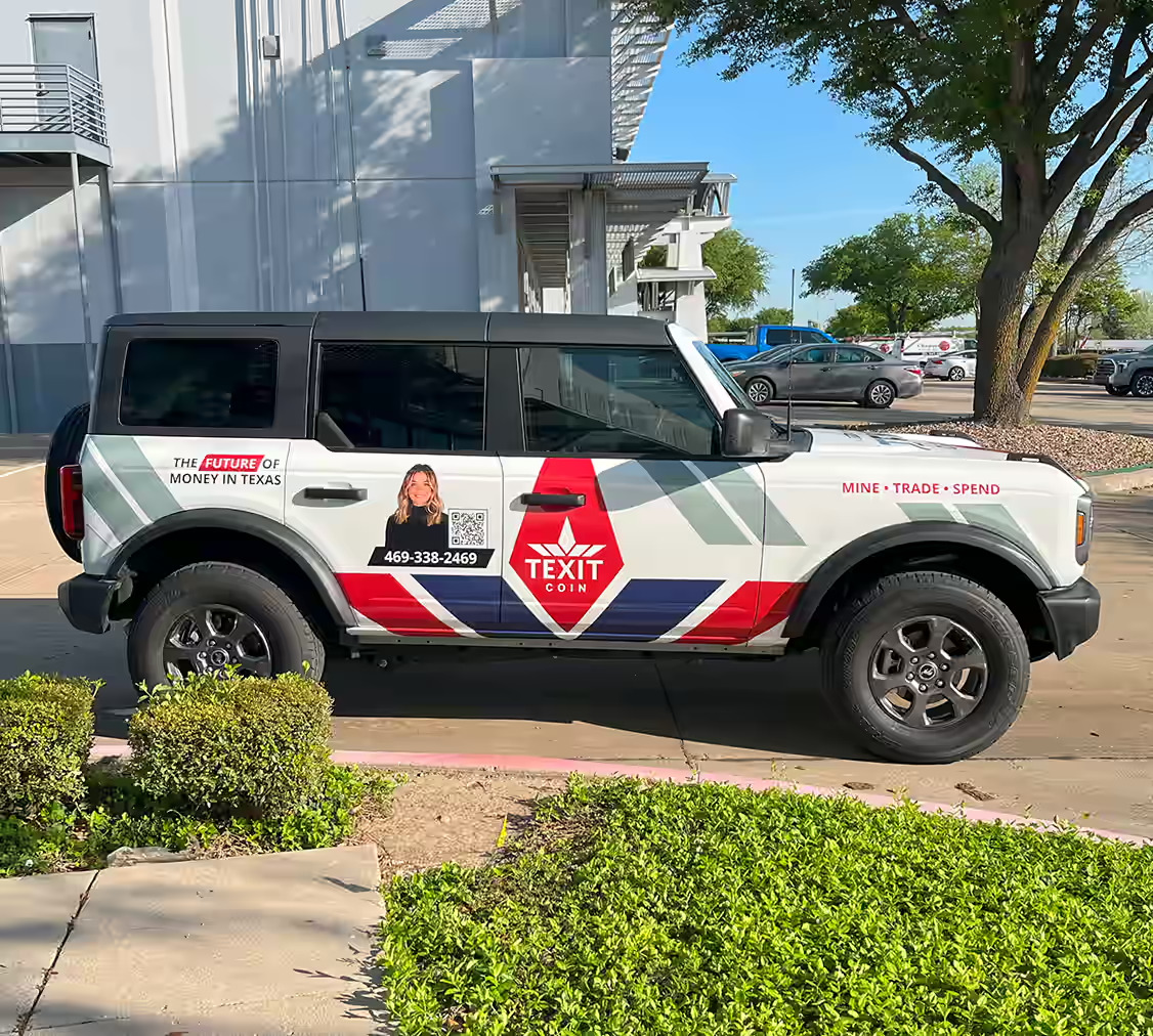 Red, white, and blue Texit Coin wrapped Ford Bronco.
