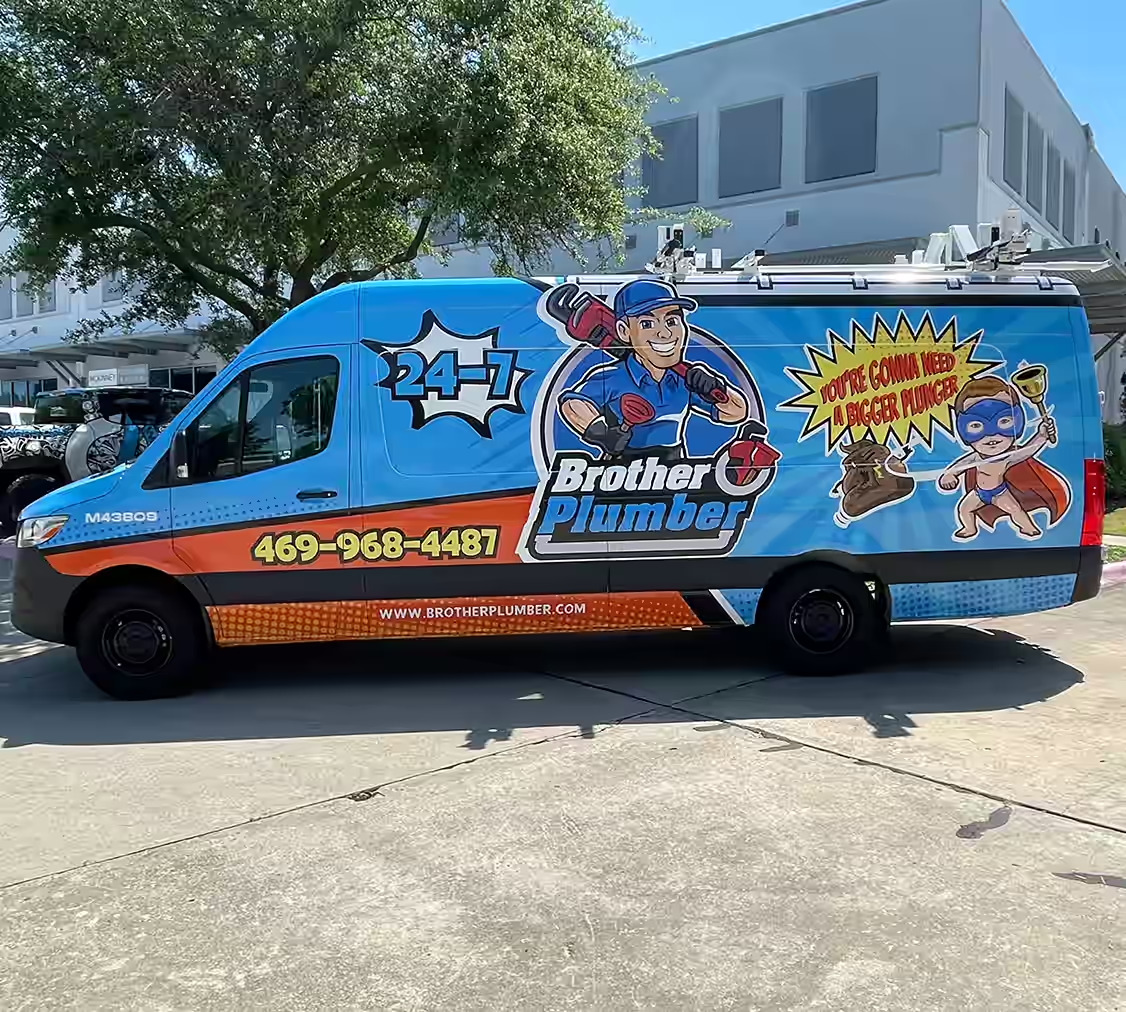 Bright blue plumbing van with a custom wrap.