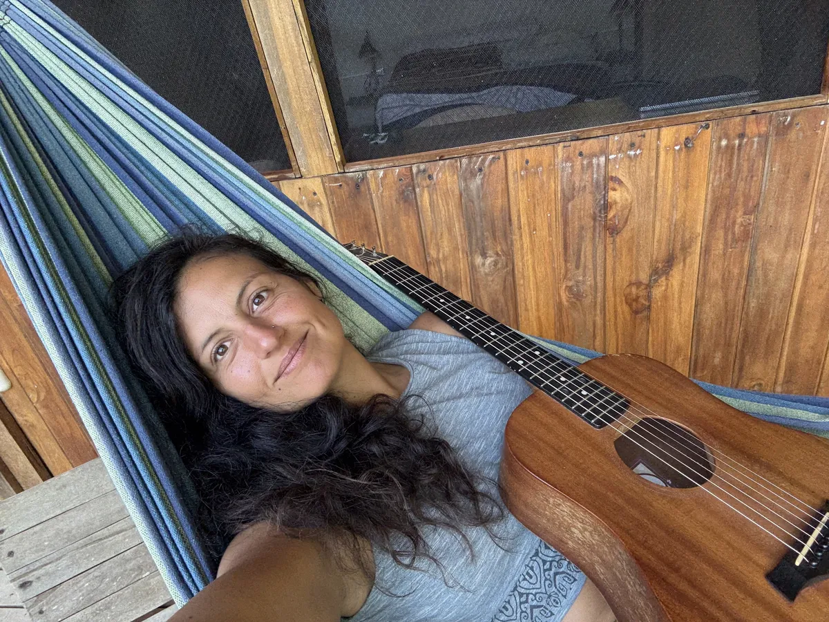 Atmospheric portrait of Leila writing music in a softly lit room