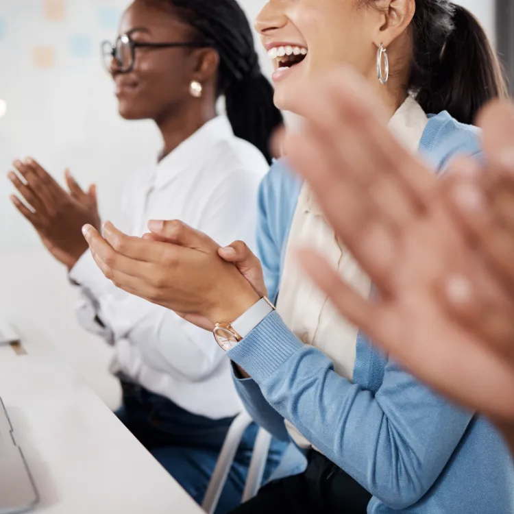 Happy women clapping