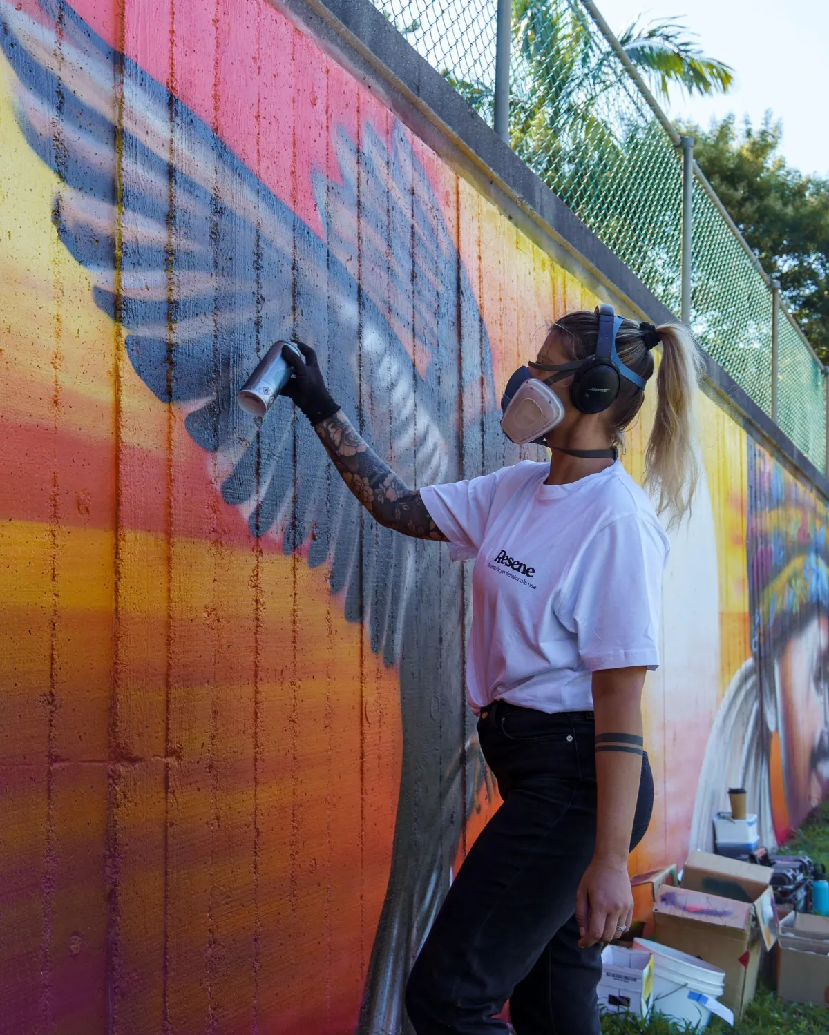 woman in black shirt standing in front of mirror