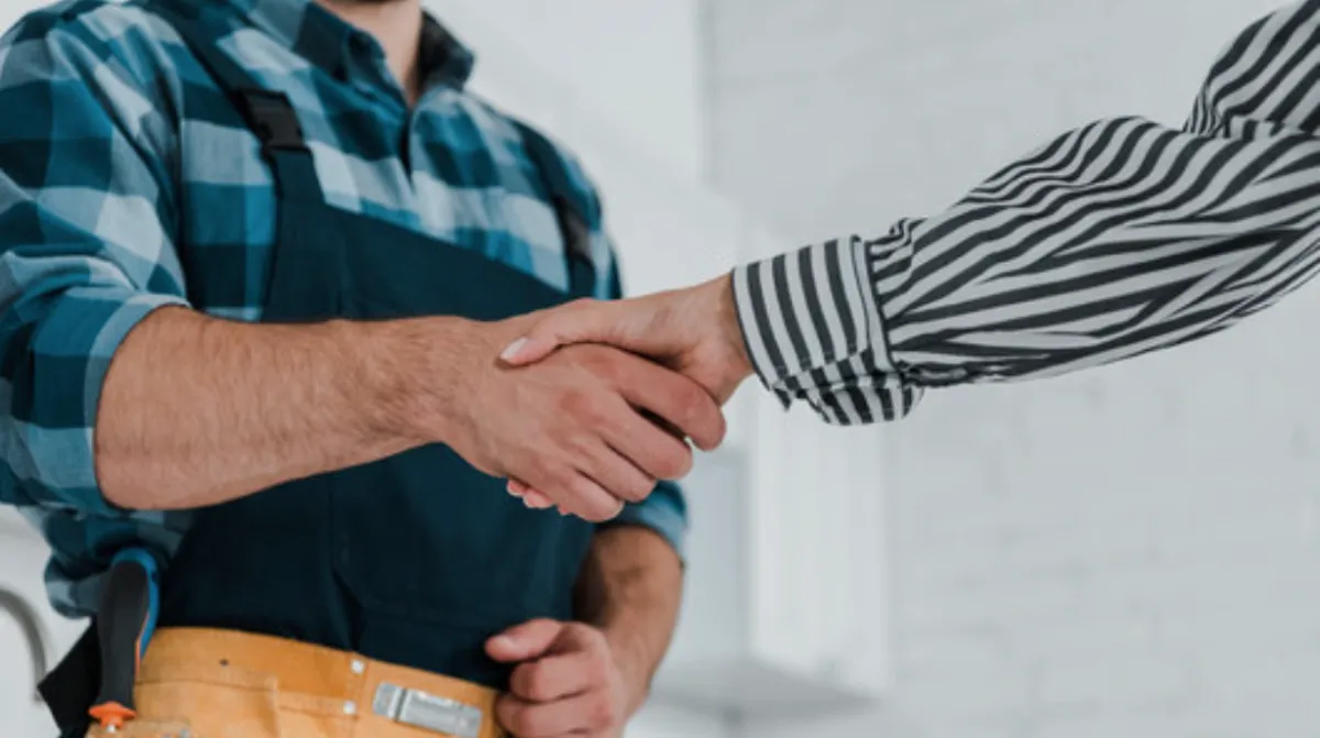 black handled scissors beside green hair comb and black handled scissors