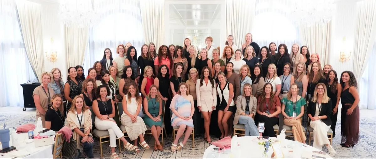Mentorship clients celebrating together at an in-person event