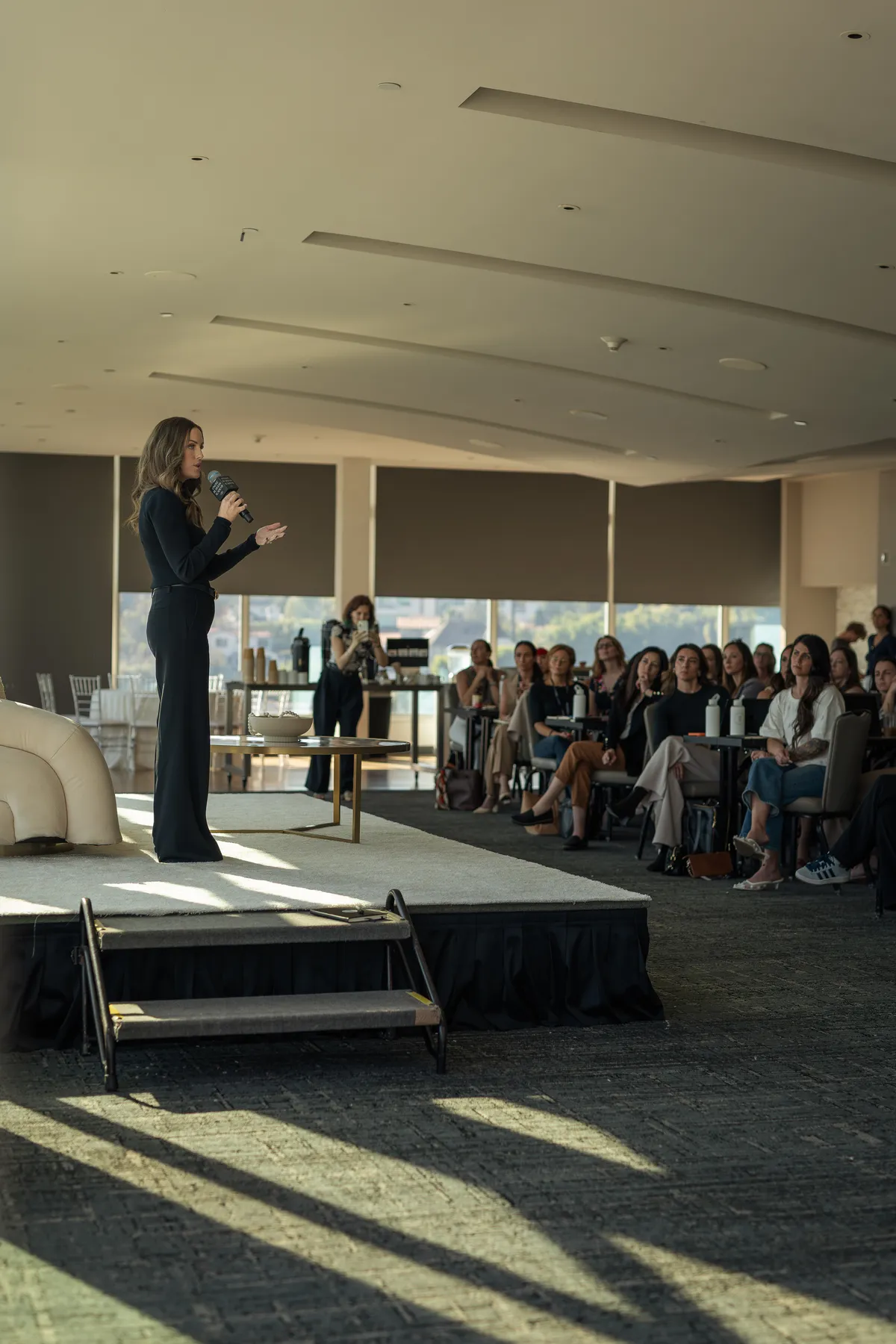 Maggie speaking at a live event