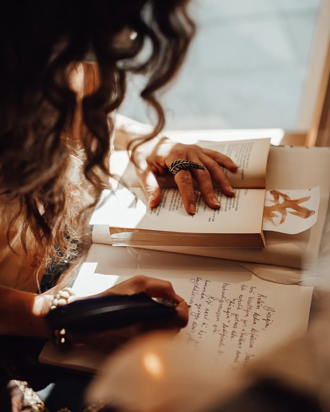 woman journalling by candlelight