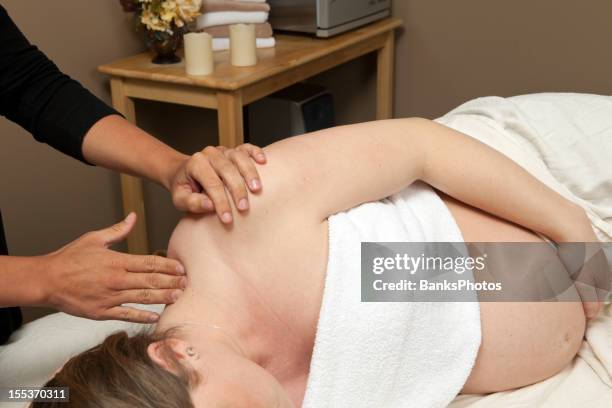 Relaxing prenatal massage setup with supportive pillows for mom’s comfort