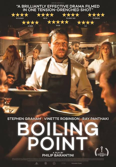 Promotional poster for Boiling Point showing a chef standing in a busy restaurant kitchen, reflecting pressure, exhaustion, tension and the hidden emotional weight people carry at work.