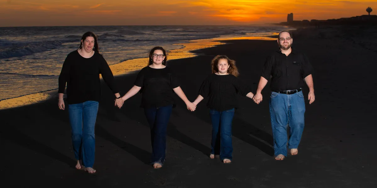 person inside vehicle holding steering wheel