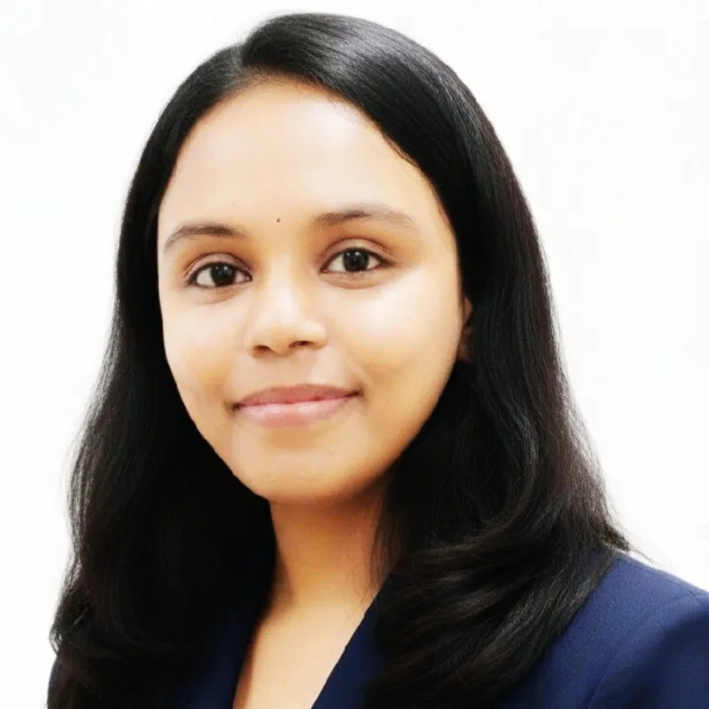 Professional head-and-shoulders portrait of an Indian woman in business clothing