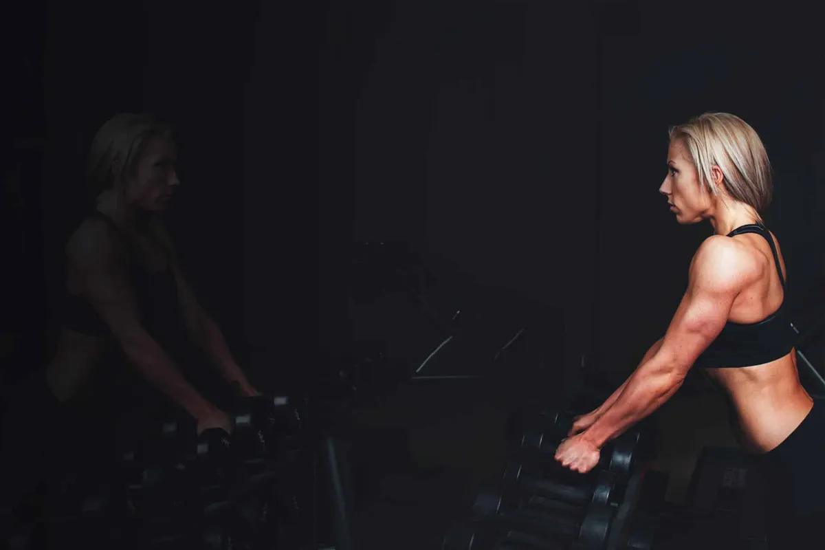 A couple of men working out in a gym