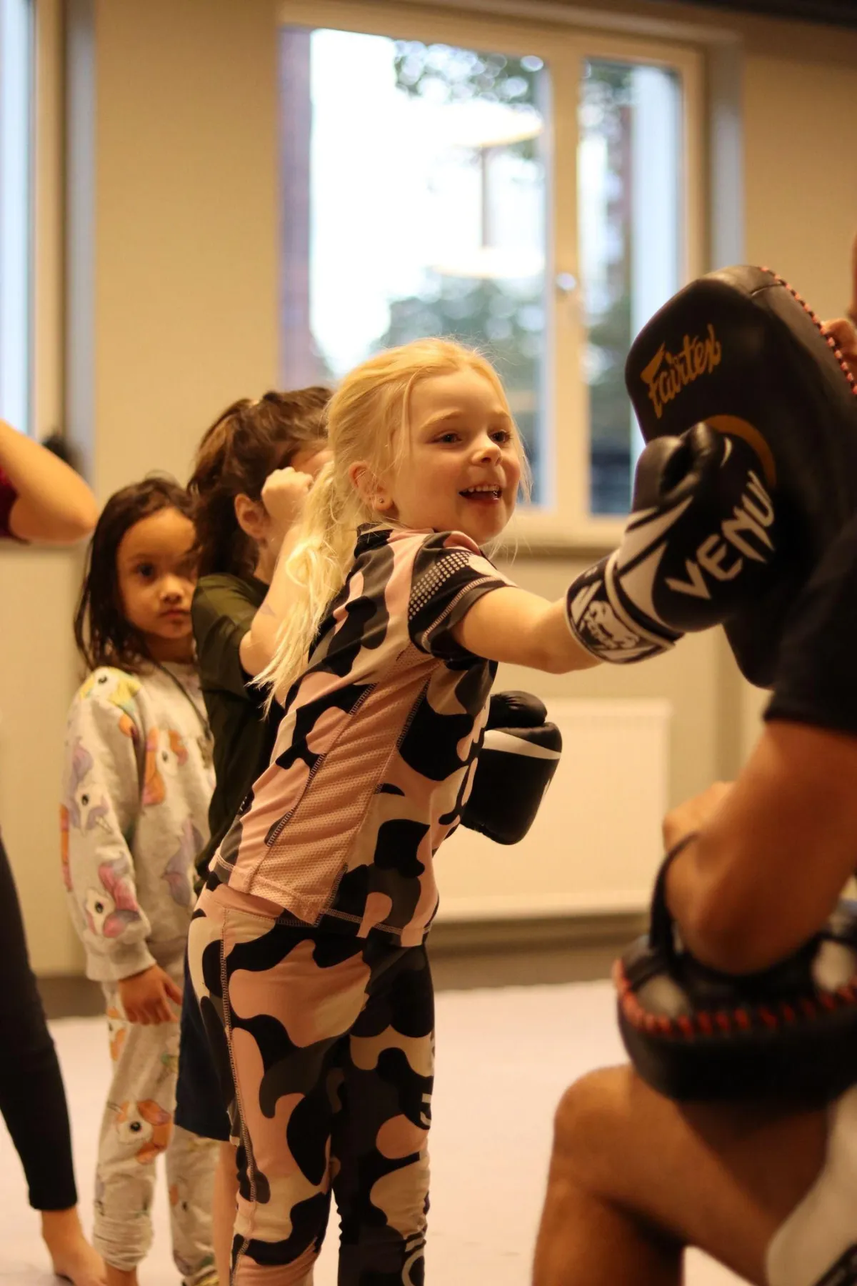 A man doing a push up on a blue mat