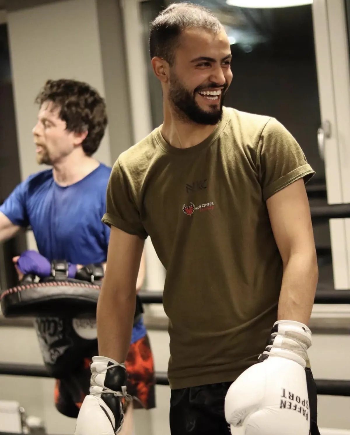 A man doing a push up on a blue mat