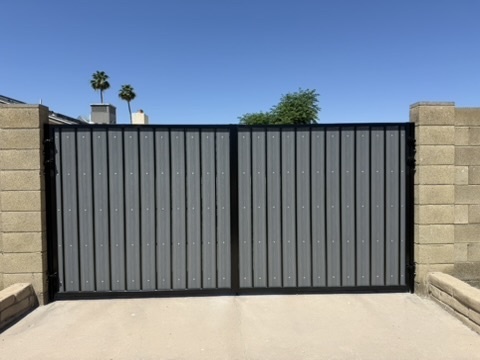 Dark charcoal double driveway gate installed in Phoenix, AZ