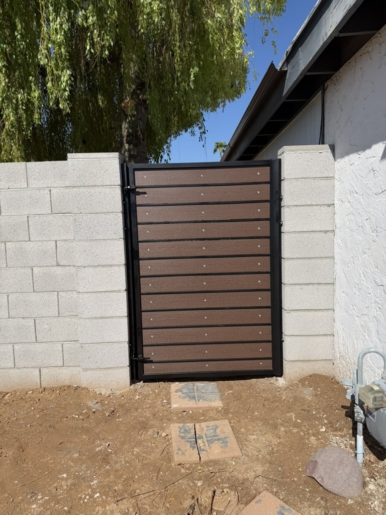 Wood-composite panel gate installed on a Phoenix, AZ block wall pillar