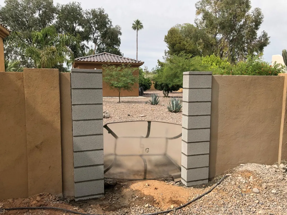 Rebuilt concrete block wall pillars for a gate opening in Phoenix, Arizona