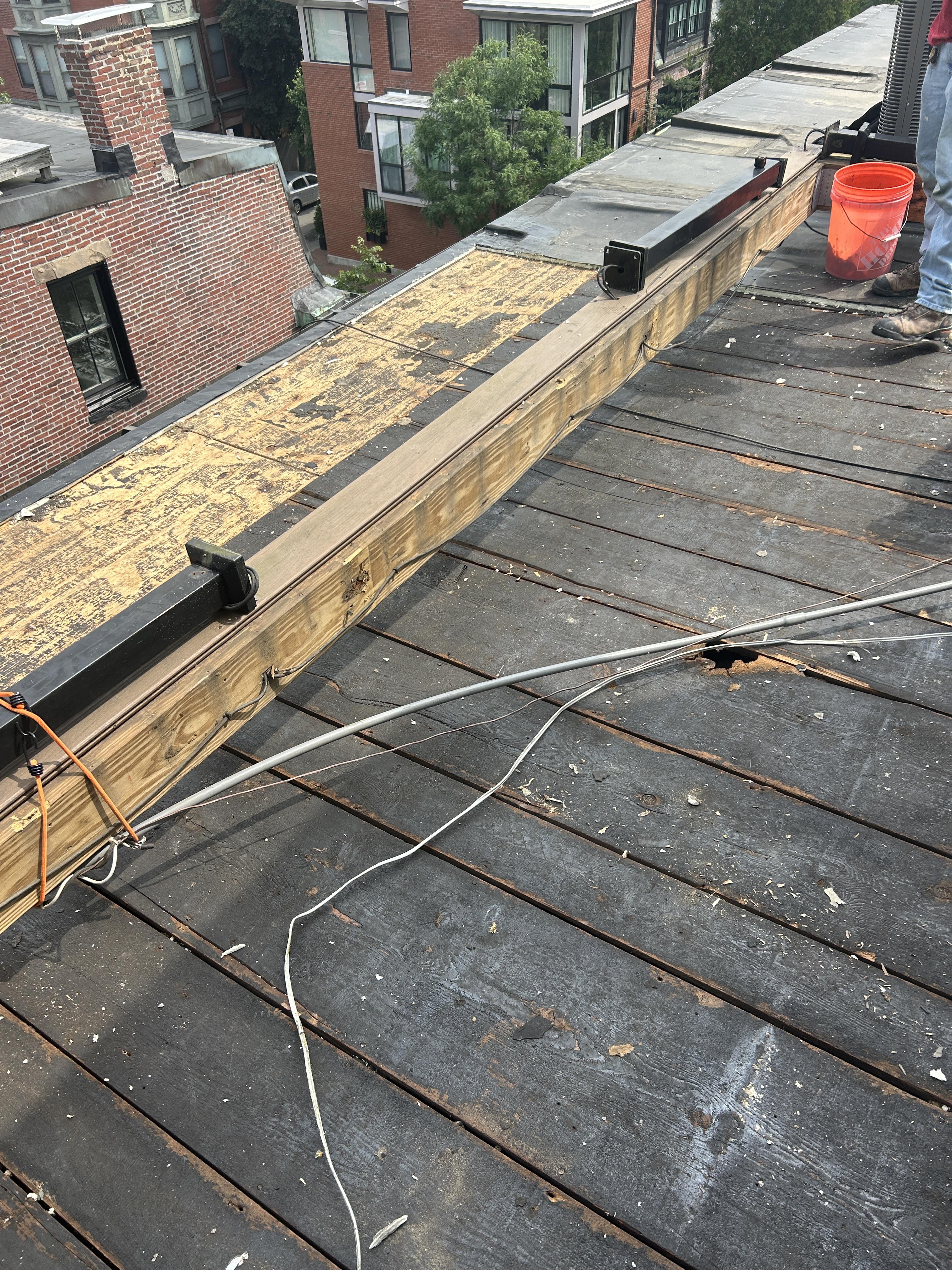 roof repair in progress for bostom residential property