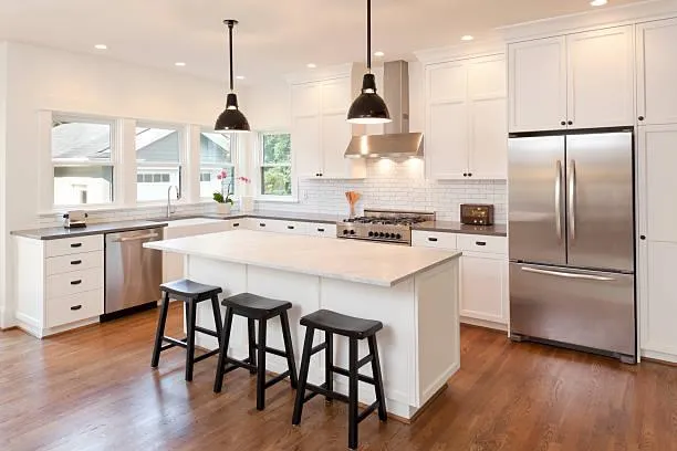 Kitchen island with pendant lighting and modern fixtures.