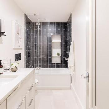 Bright white bathroom with vanity, tiled shower, and bath combo.