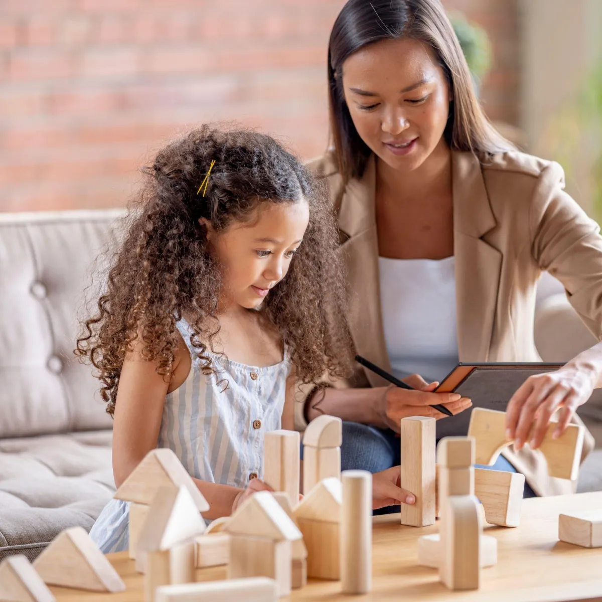 Therapist playing with blocks with a child