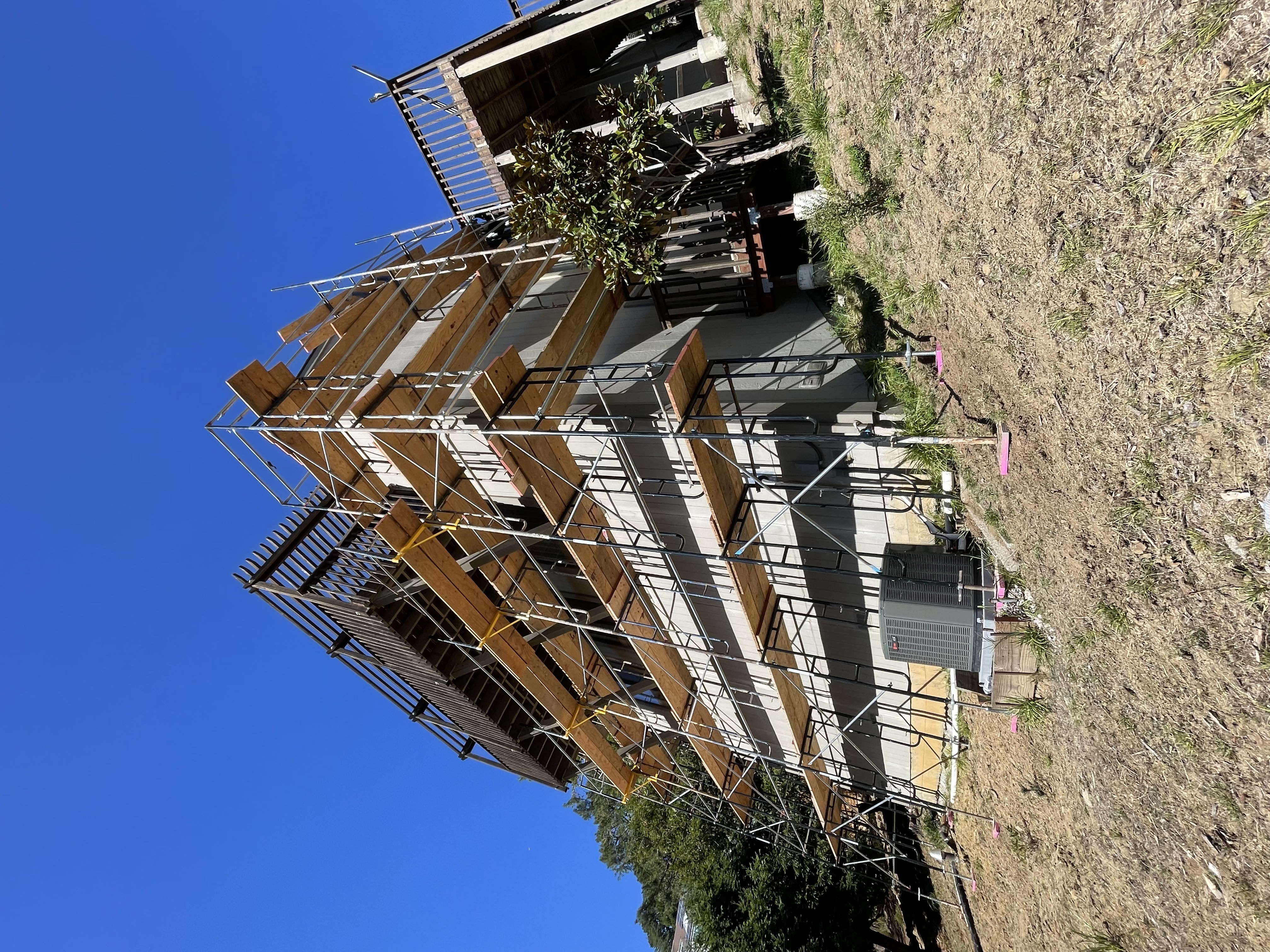 Construction scaffolding surrounding modern building