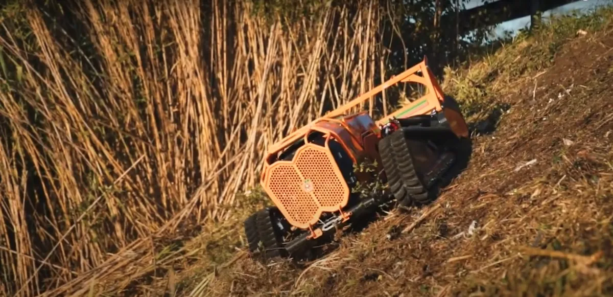 Remote-controlled brush cutter reclaiming overgrown land in Marion County.