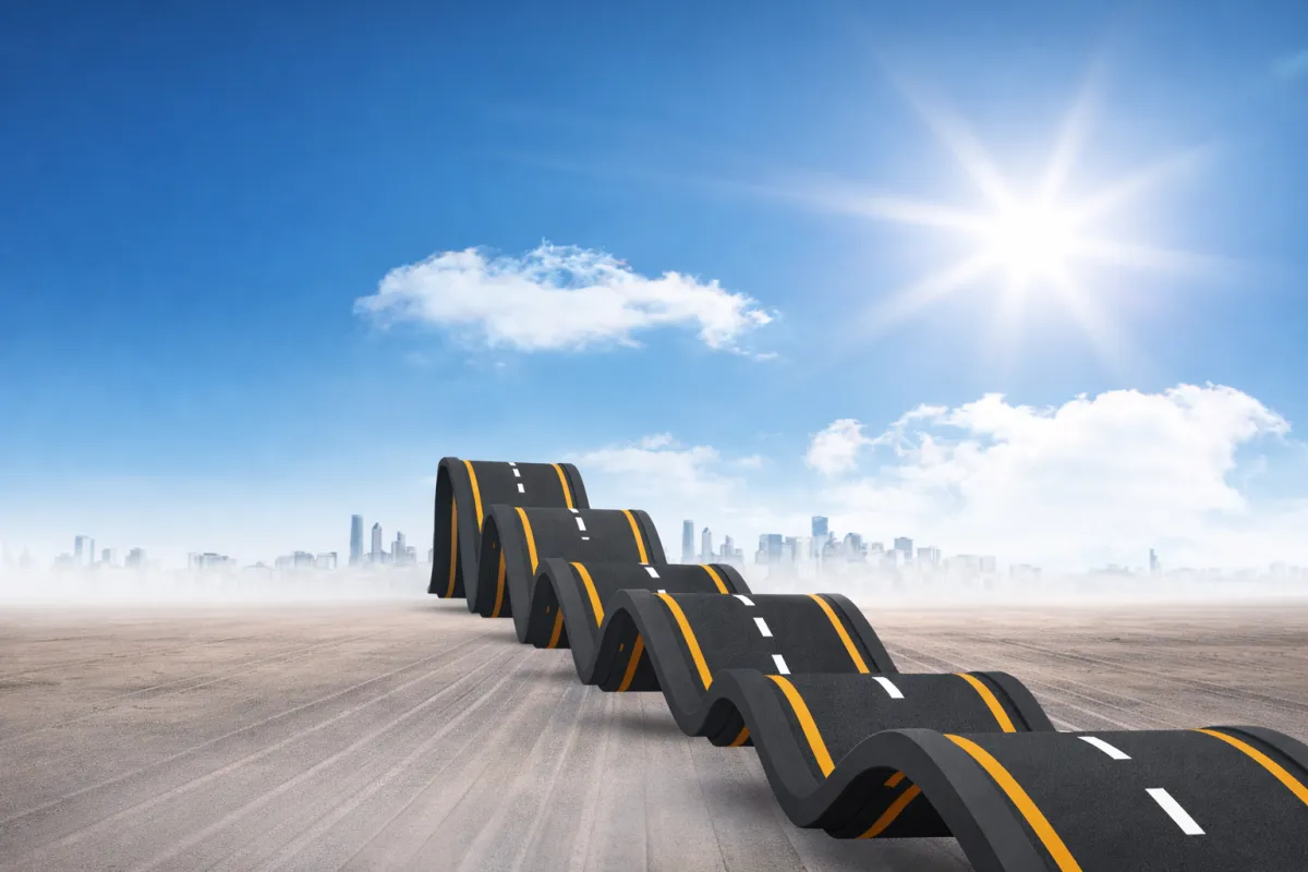 Winding road symbolizing transformation in the market research industry from legacy systems to AI-driven insights and innovation.