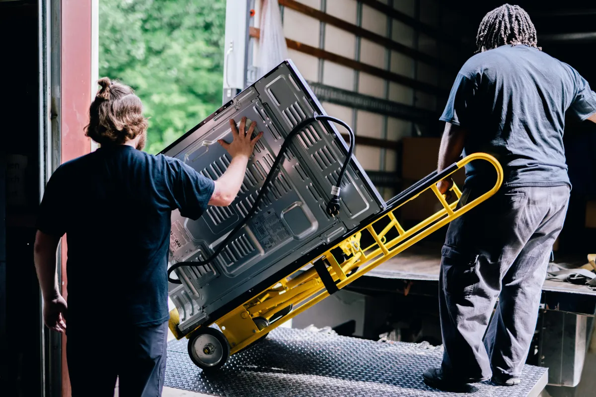 brown cardboard box on gray car