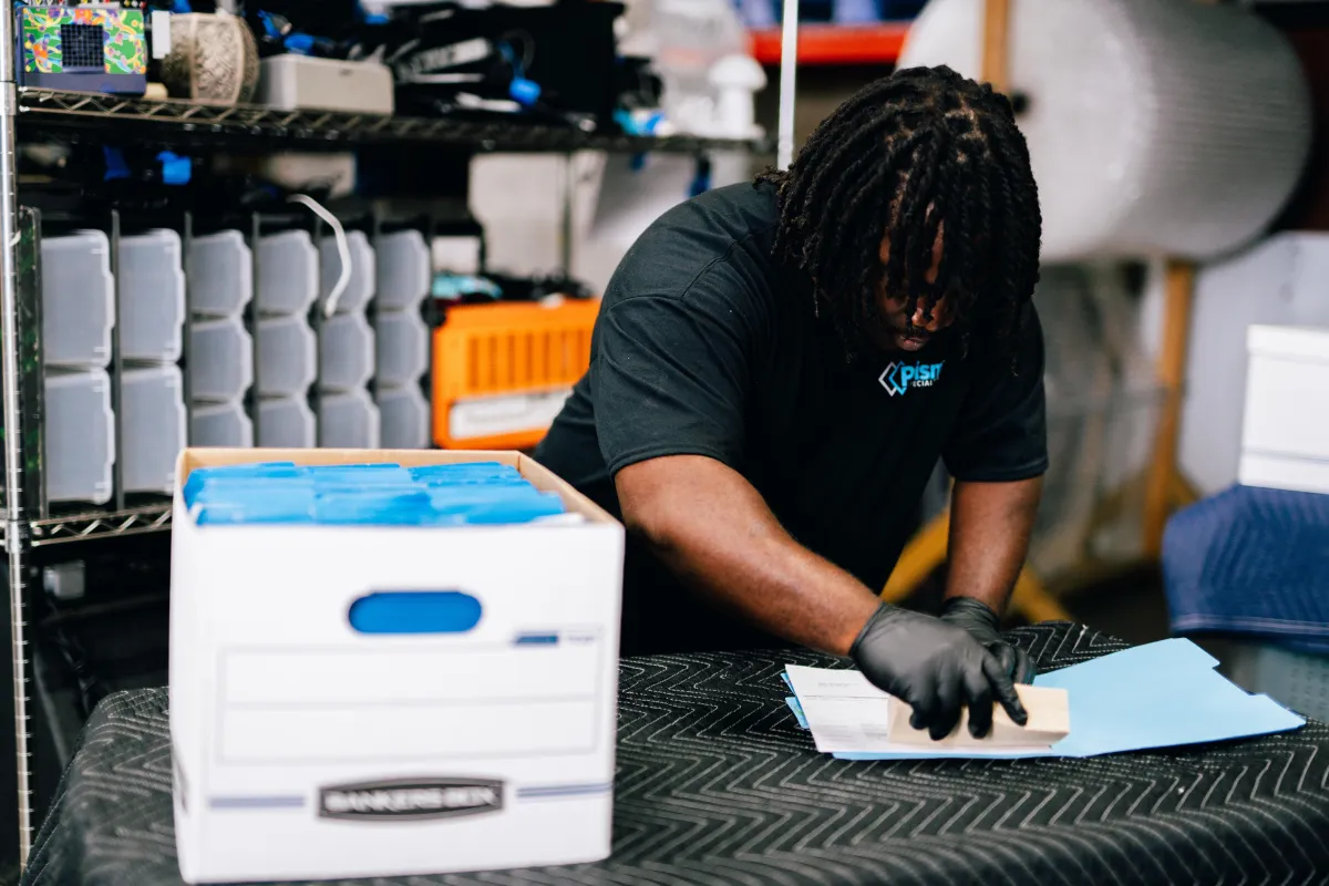 a close up of a purple flower with a yellow center