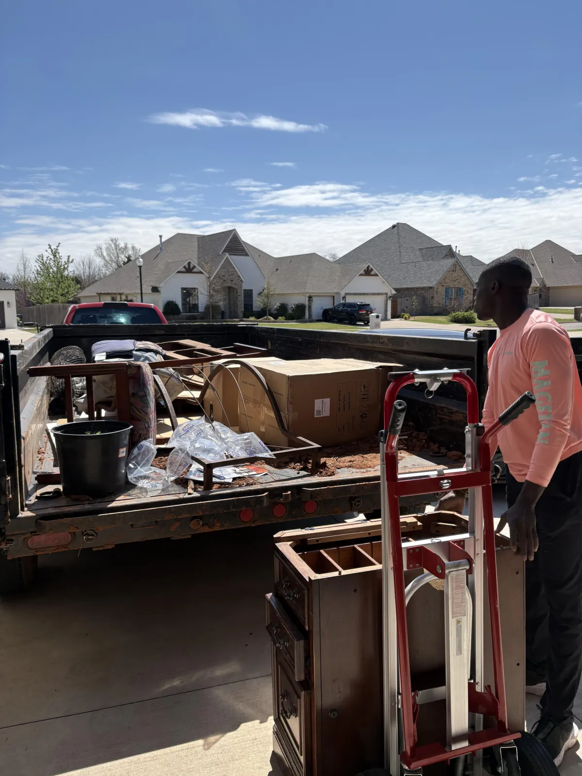 Crew from Sooner State Haulers loading junk into a truck in Oklahoma City