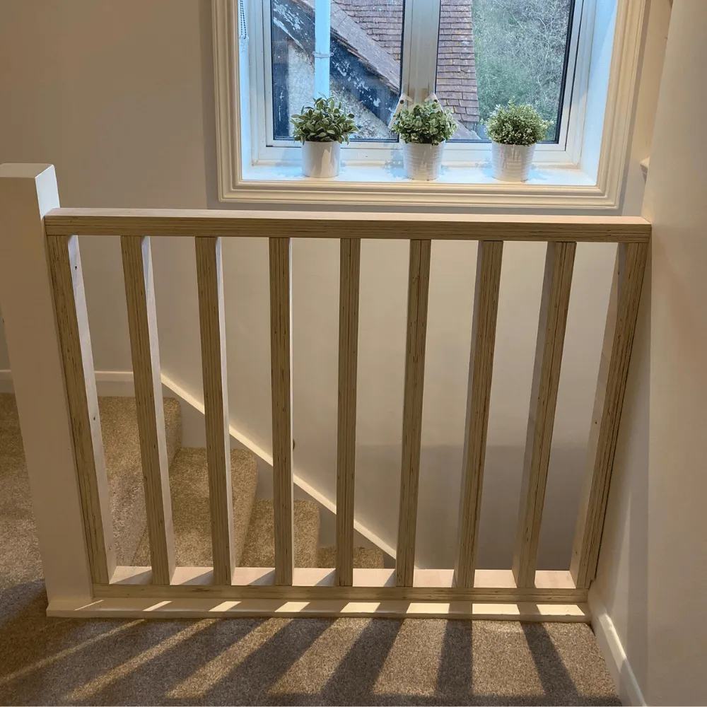 Wooden railings that we fitted next to a stairs in a home in Tunbridge Wells