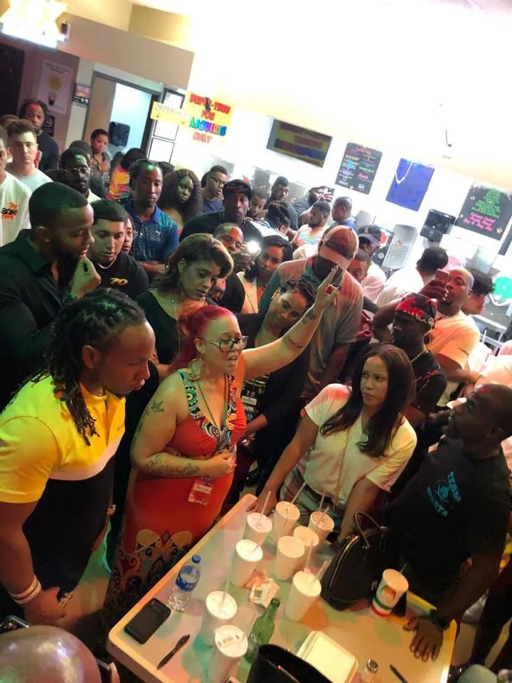 two people drawing on whiteboard