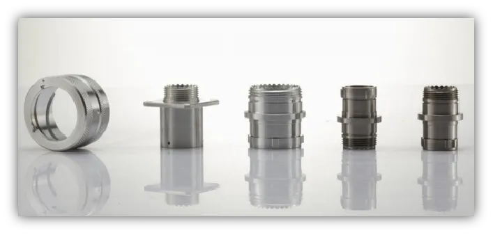 man in blue crew neck t-shirt holding black and white bottle