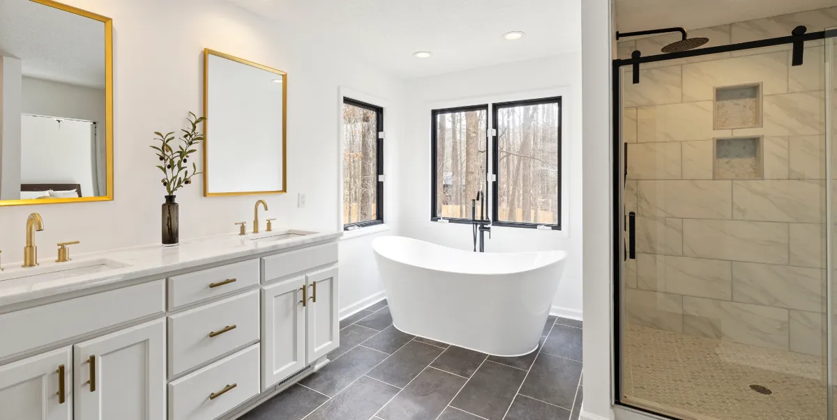 Custom kitchen renovation with new cabinetry, countertops, lighting, and open layout design