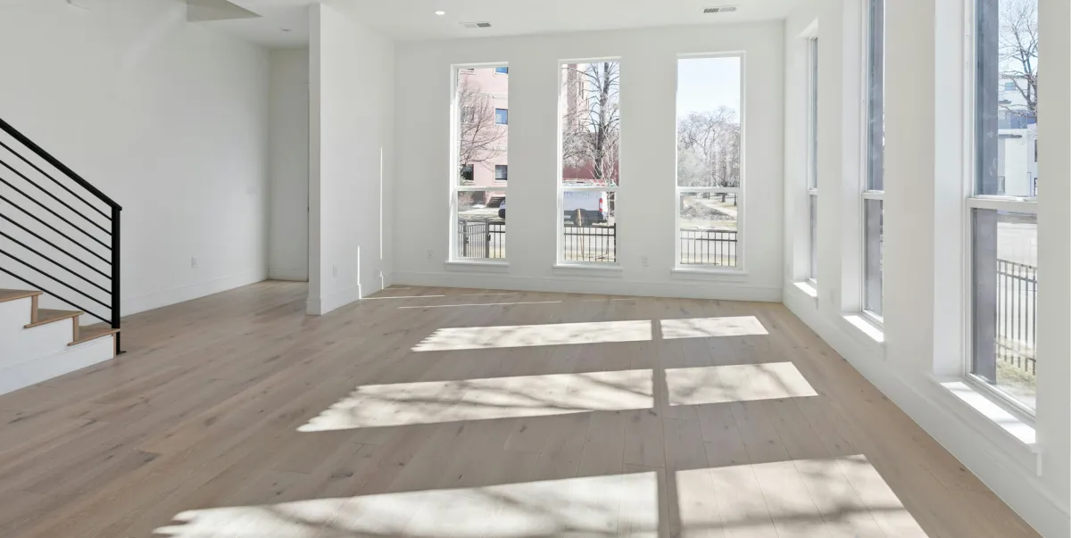 Custom kitchen renovation with new cabinetry, countertops, lighting, and open layout design