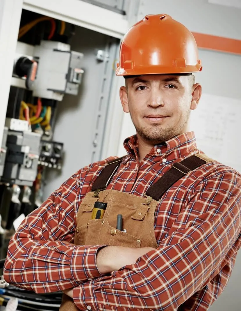 construction worker in orange hard hat and plaid shirt