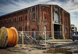 ATEX Services adaptive reuse architecture transforming historic industrial building into modern usable space in Texas and Colorado
