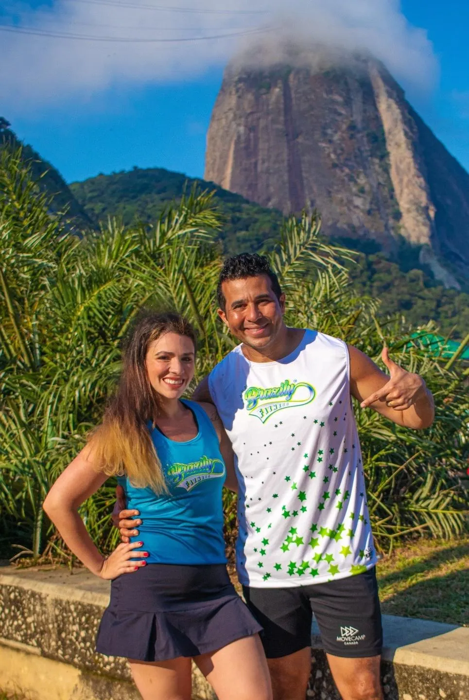 Woman and man smiling, Brazilian dance fitness, sugar loaf mountain, beach in Rio de Janeiro, Brazil 