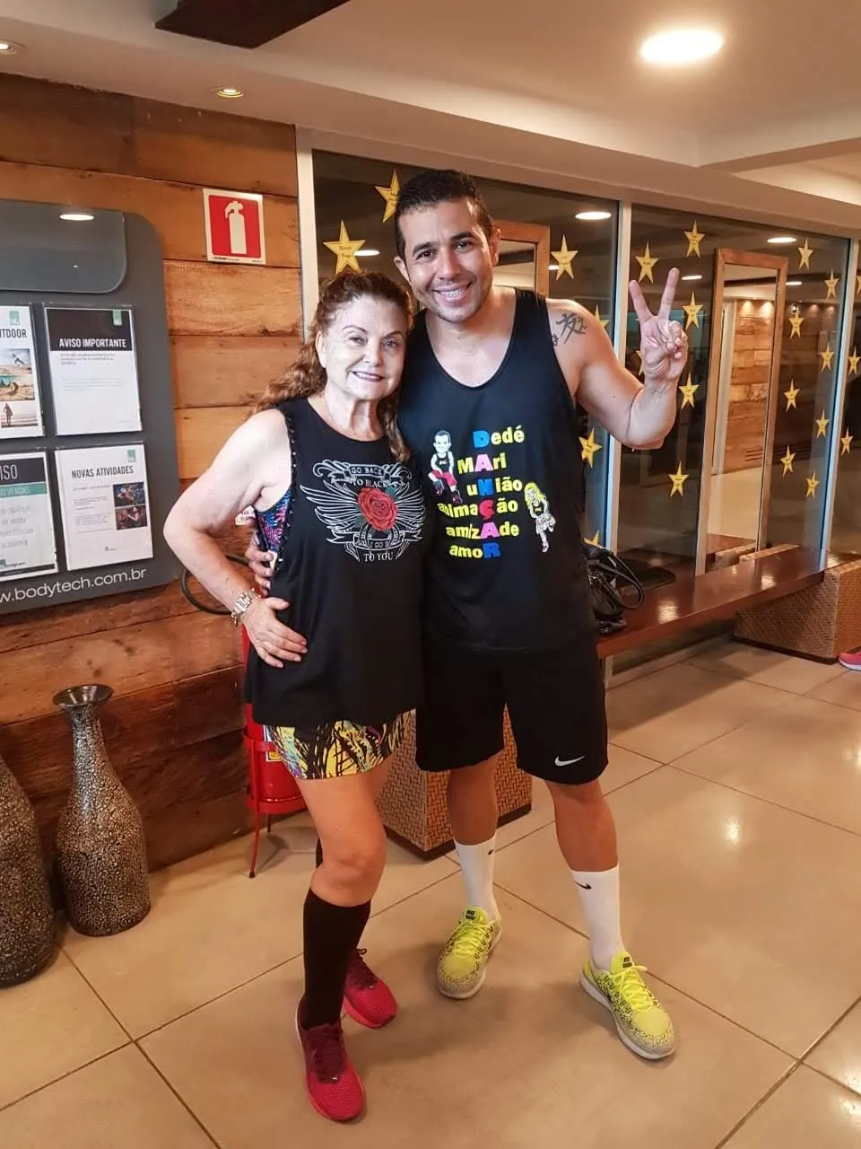 Woman and man smiling together after Brazilian dance fitness class