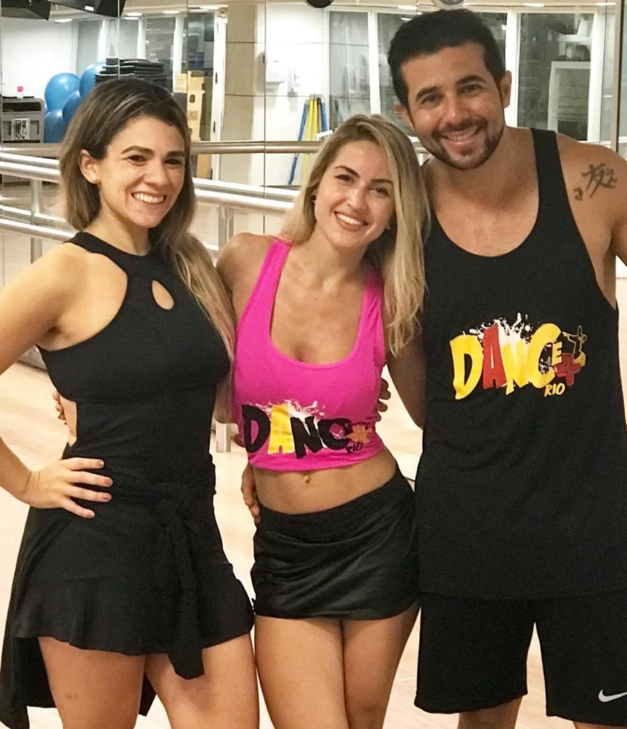 Two women and one man smiling together after Brazilian dance fitness class