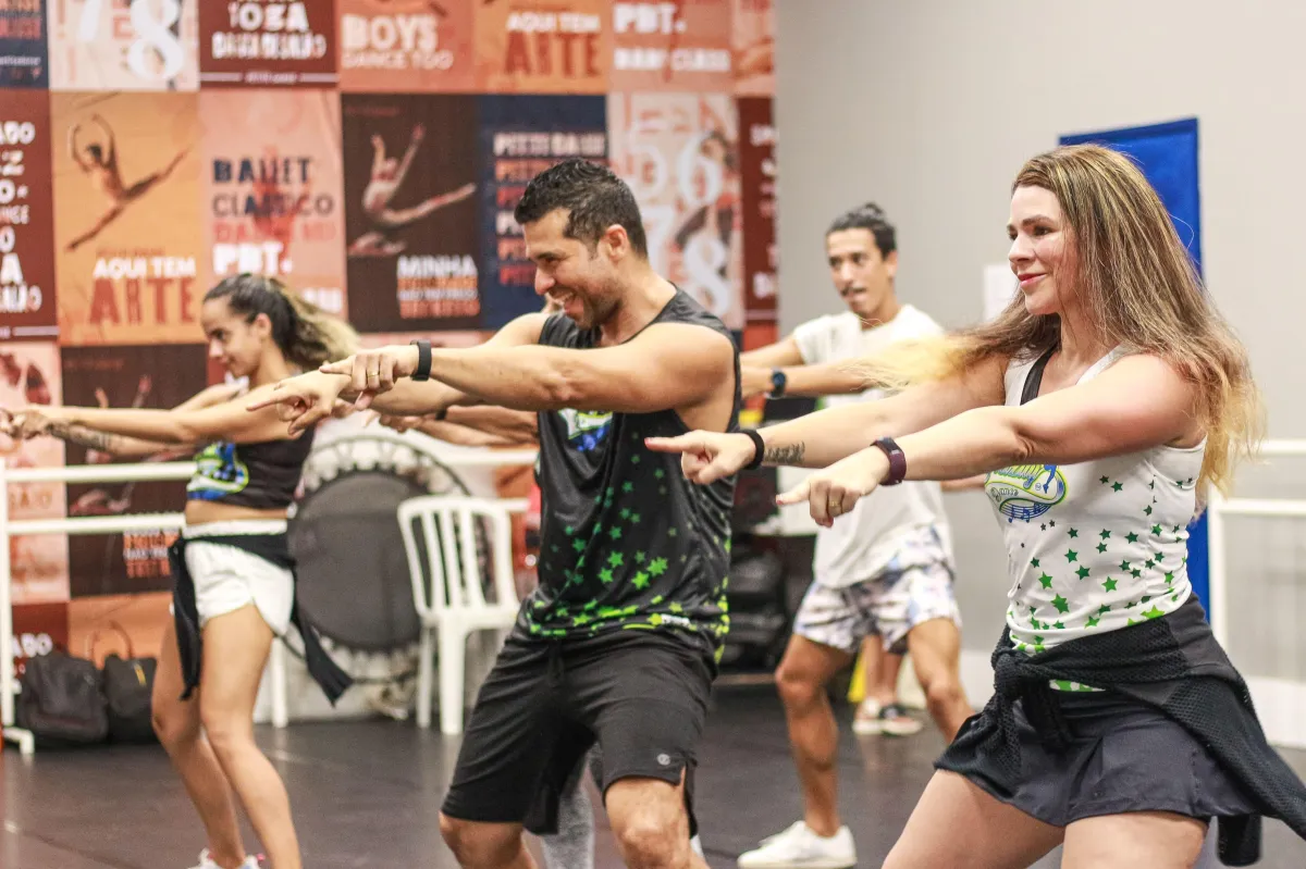 Happy people dancing, Brazilian dance fitness class