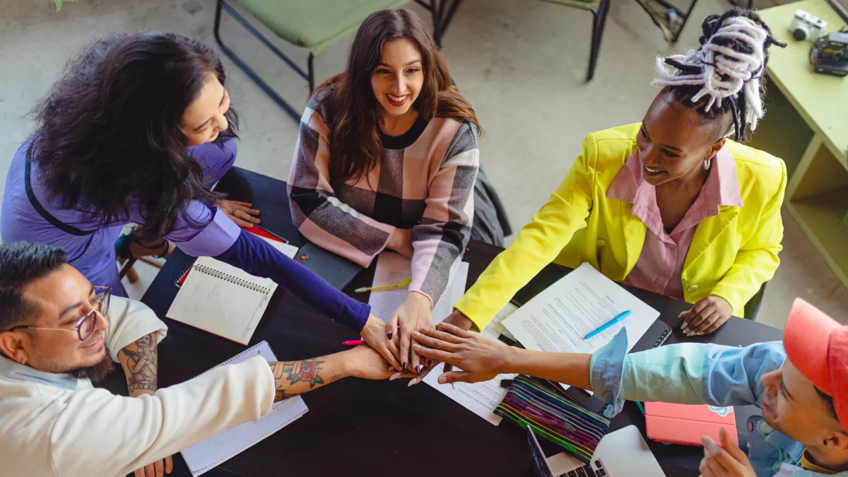 woman placing sticky notes on wall