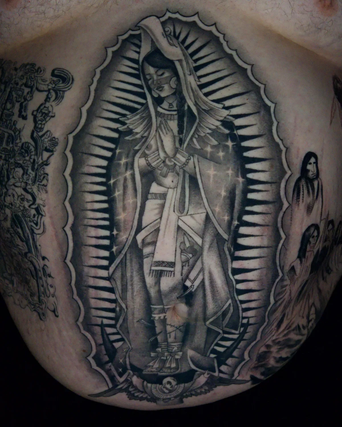 A delicate botanical tattoo wraps around a woman’s forearm, featuring fine line peonies and eucalyptus leaves. The design is minimalist, with subtle shading, and the photo is taken in natural daylight, emphasizing the softness and elegance of the artwork.