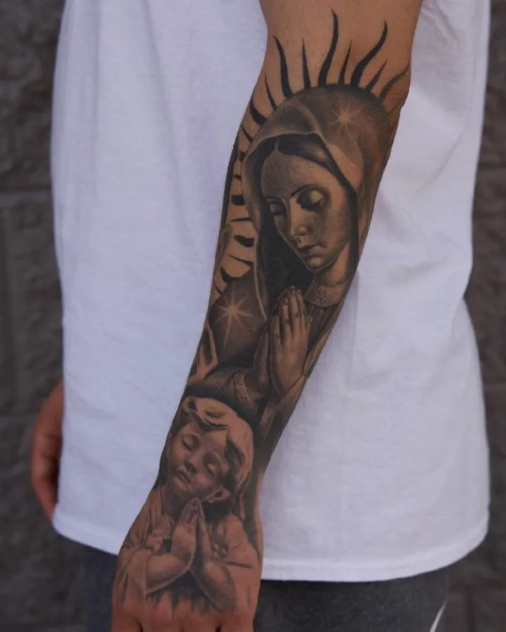 A geometric wolf tattoo in blackwork style, placed on a man’s upper arm. The design features sharp lines, dotwork shading, and abstract shapes forming the wolf’s face. The image is shot in a modern studio with a dark background, highlighting the bold contrast.