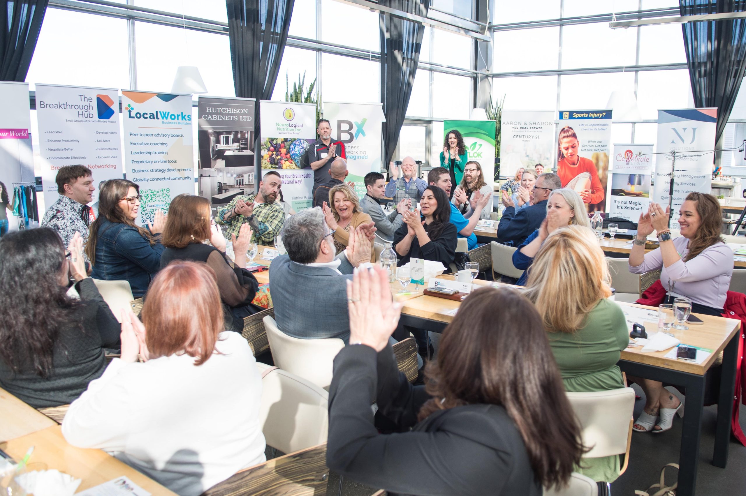 man in blue long sleeve shirt holding smartphone
