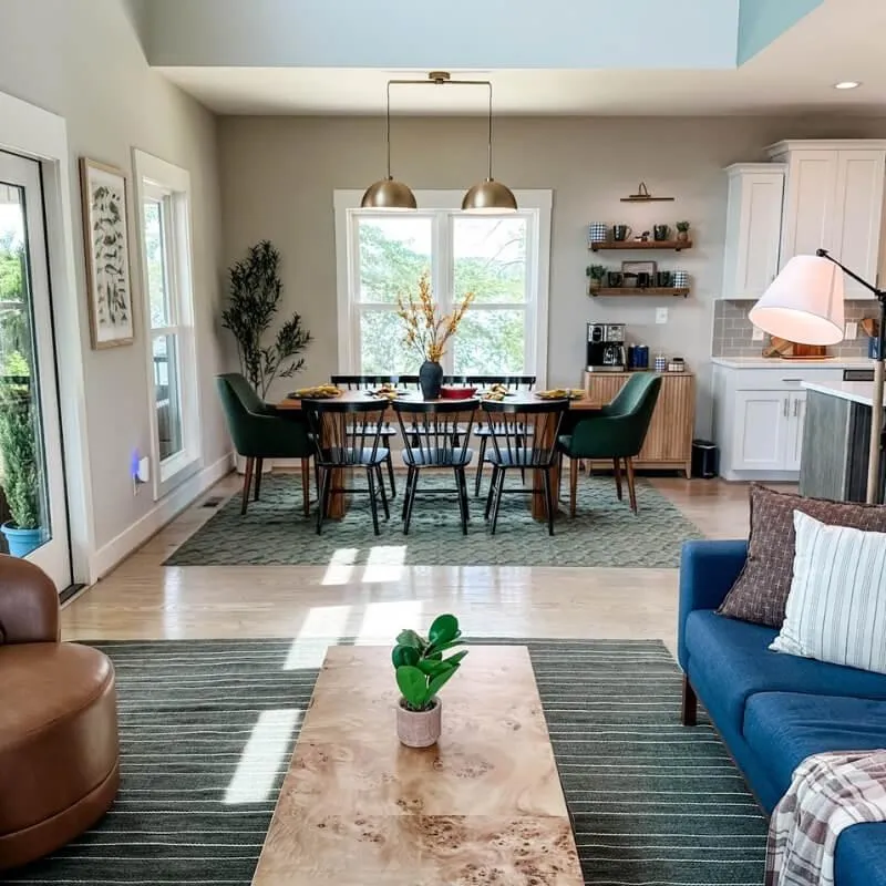 Living room with lay lake-facing doors - rental for guys golf trip