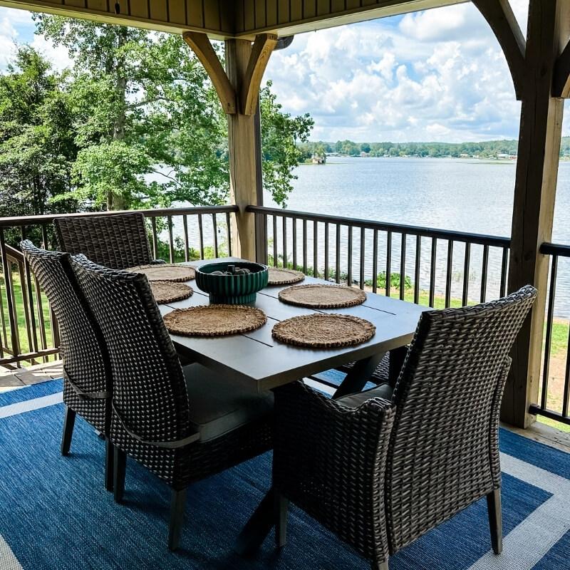 Covered deck outdoor dining table Lay Lake vacation rental