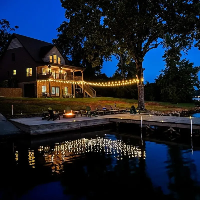 Night boathouse reflection and lakeside firepit Lay Lake Mallards Nest